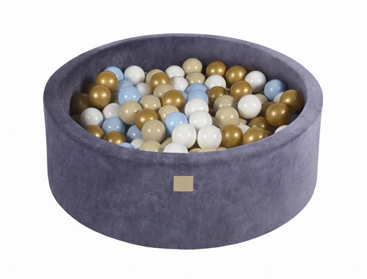 A round grey-blue velvet ball pit filled with multicolored balls, designed for children's play.