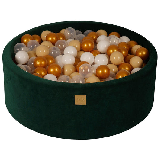 Dark green round ball pit filled with white and grey balls