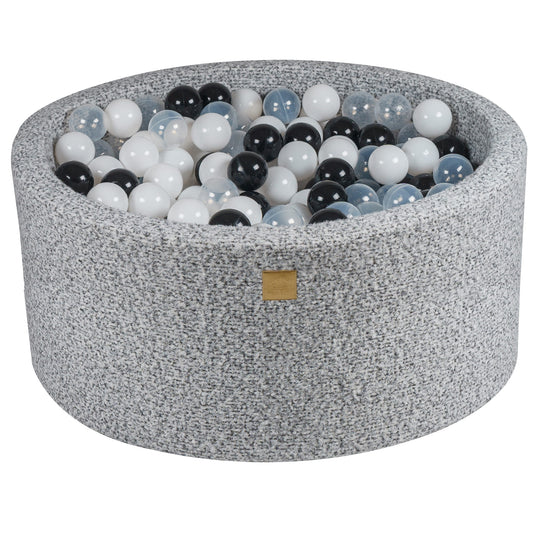 Grey fabric toddler ball pit with soft pastel play balls