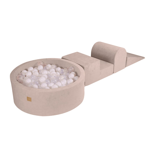 A beige velvet ball pit with a collection of white balls inside, designed for young children's play.
