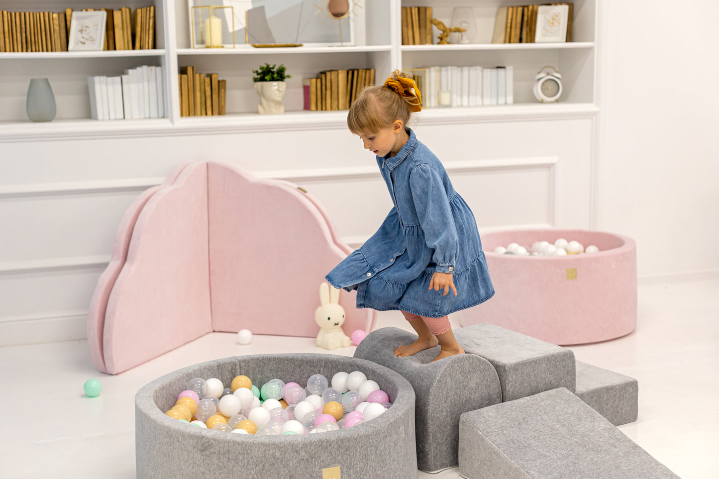 Soft pink foam ball pit for toddlers with pastel balls