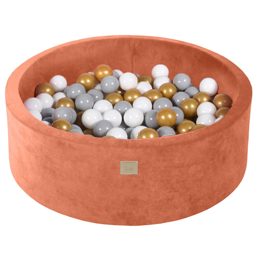 Terracotta colour toddler ball pit with play balls