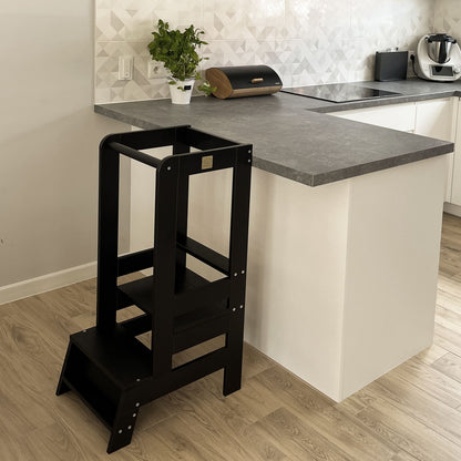 Meowbaby black kitchen helper designed for toddlers in kitchen setting.