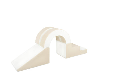 Side view of a beige-coloured arch soft play set, partially displayed, designed for toddlers to climb, explore, and play safely.