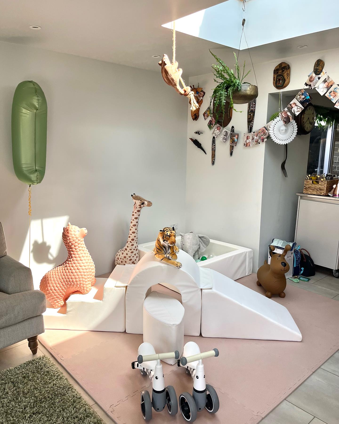 Mixed soft play sets and toys with giraffes and a bike.